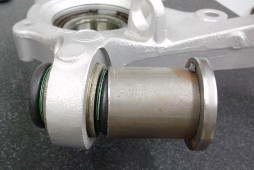 Use the small removal cup on the retaining ring side of the cross-axis joint CROSS-AXIS JOINT SMALL REMOVAL CUP OVER BOOT